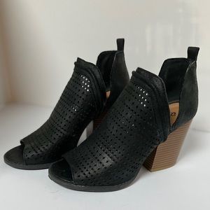 Open toe laser cut booties.